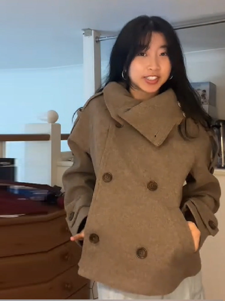 Front view of the short taupe wool blend coat with two rows of buttons closed