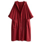 Hooded long coat styled open over a dark knit for a casual autumn look