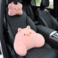 Pink pig headrest pillow on the seat headrest and pink pig lumbar pillow on a black car seat