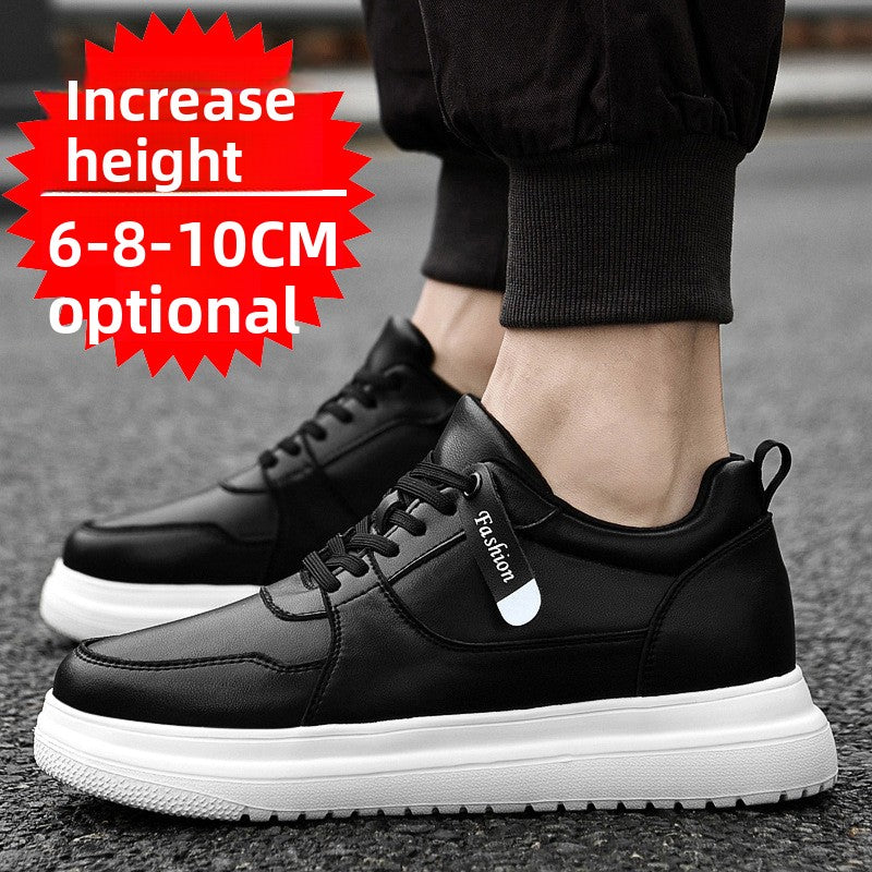 Black low-top sneakers with a Fashion tag strap and a chunky white sole, worn with black joggers on a street