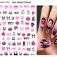Halloween nail decals shown as a finished manicure with skulls and pumpkins