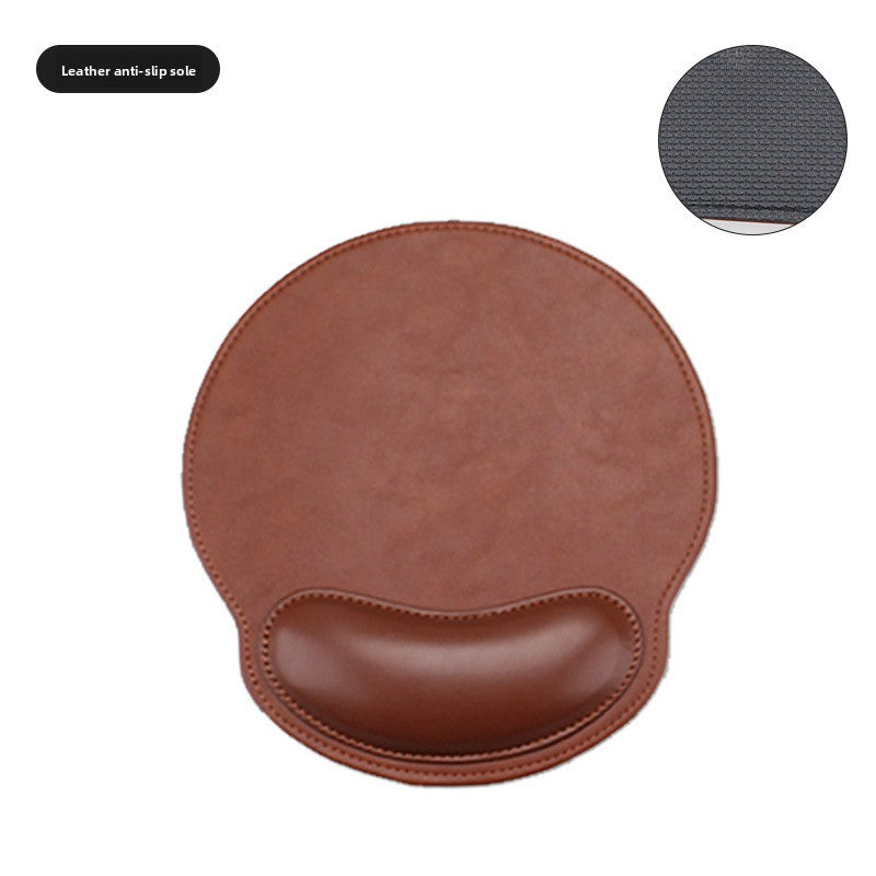 Brown memory foam wrist rest mouse pad on a wooden desk