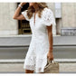Close view of white lace dress V neckline and front covered button placket