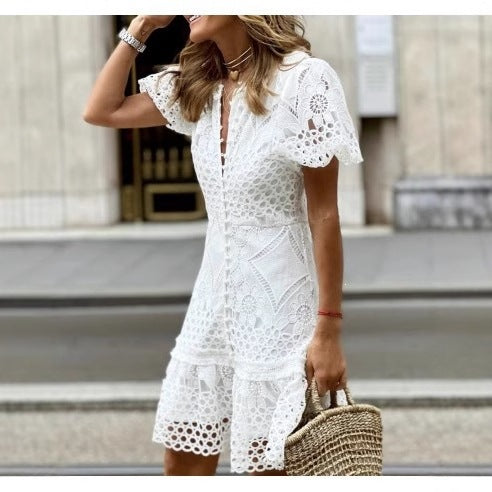 Close view of white lace dress V neckline and front covered button placket
