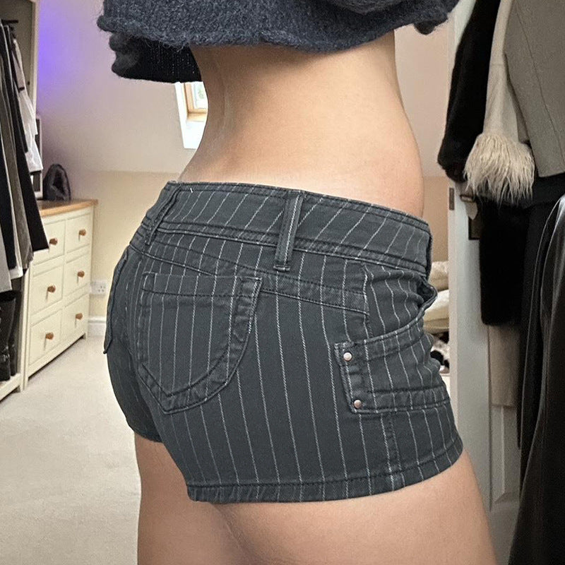 Flat lay of the charcoal grey pinstripe denim shorts with white top stitched pockets