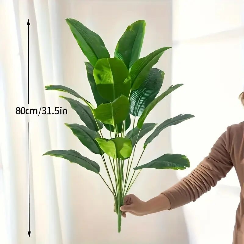 Artificial traveler banana plant leaves fanned out on bendable green stems