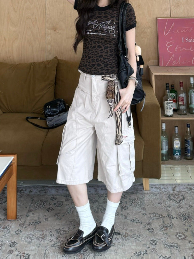 Full styled look of khaki wide leg cargo pants with fitted top and loafers