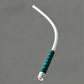 Flexible LED work light propped in a tight space lighting a work area