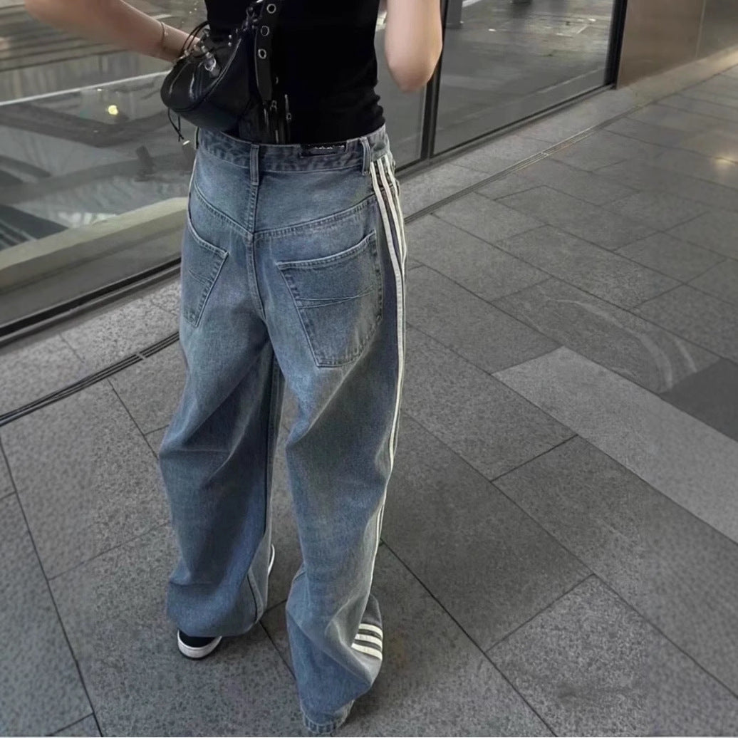 Washed black baggy denim jeans shown from the back with two rear pockets