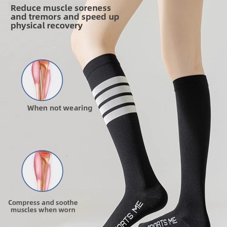 Legs in black striped compression calf socks showing snug hold around the calf muscle
