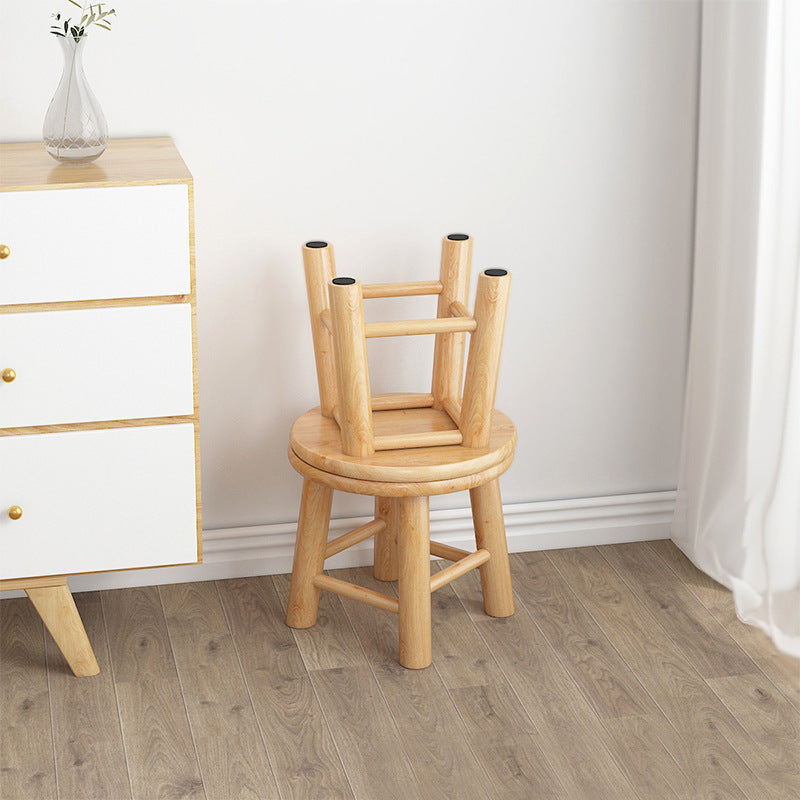 Round wooden low stool shown at 25 cm sitting height with natural log wood finish
