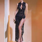 Full length black lace maxi dress with keyhole collar, gold tone ring and high slit, worn with a clutch, size M option