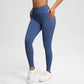Woman in steel blue seamless yoga leggings with a hand on the hip and white sneakers