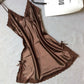 Brown satin slip nightdress with brown lace trim and small bows, flat on a gray cloth, option photo for size XXL