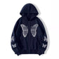 Close up of the soft fleece and the rhinestone butterfly motif on the hoodie