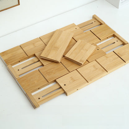 Bamboo drawer dividers assembled into a grid with two loose panels on top
