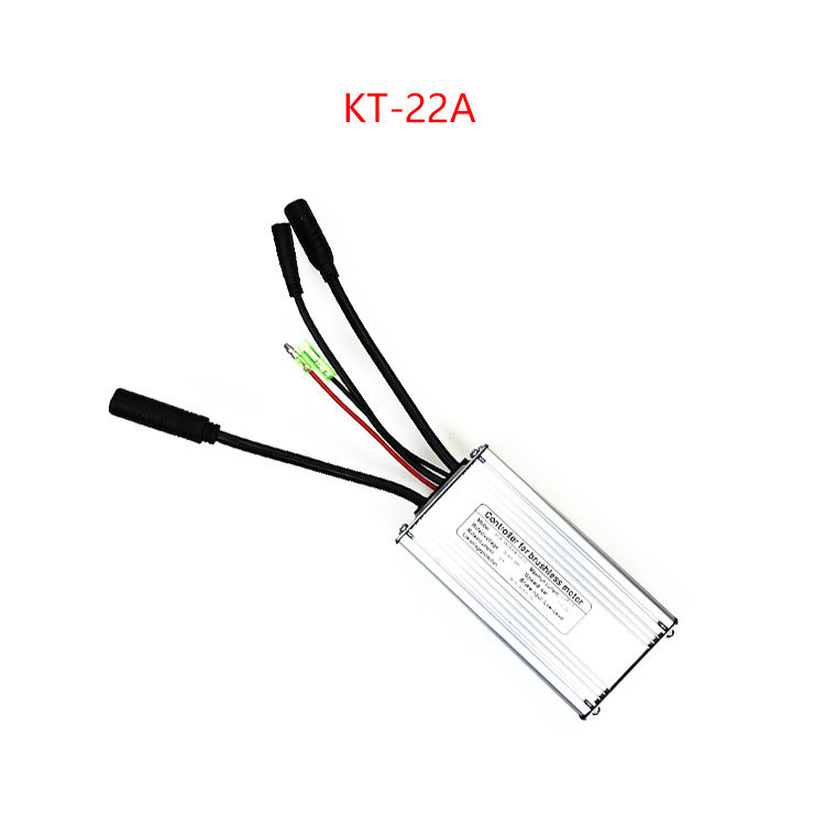 Silver finned e-bike controller marked KT-22A with its black waterproof connector leads on white