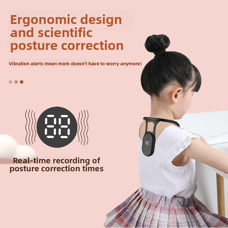 Young child at a desk wearing the black posture trainer with its digital vibration reminder pod
