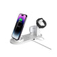 White four in one charging stand with phone, watch and earbuds and a USB cable at the base