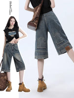 Retro high-waist denim shorts in faded indigo, front view
