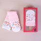 High tube food print crew socks in combed cotton, shown as rolled sushi pieces with toy chopsticks