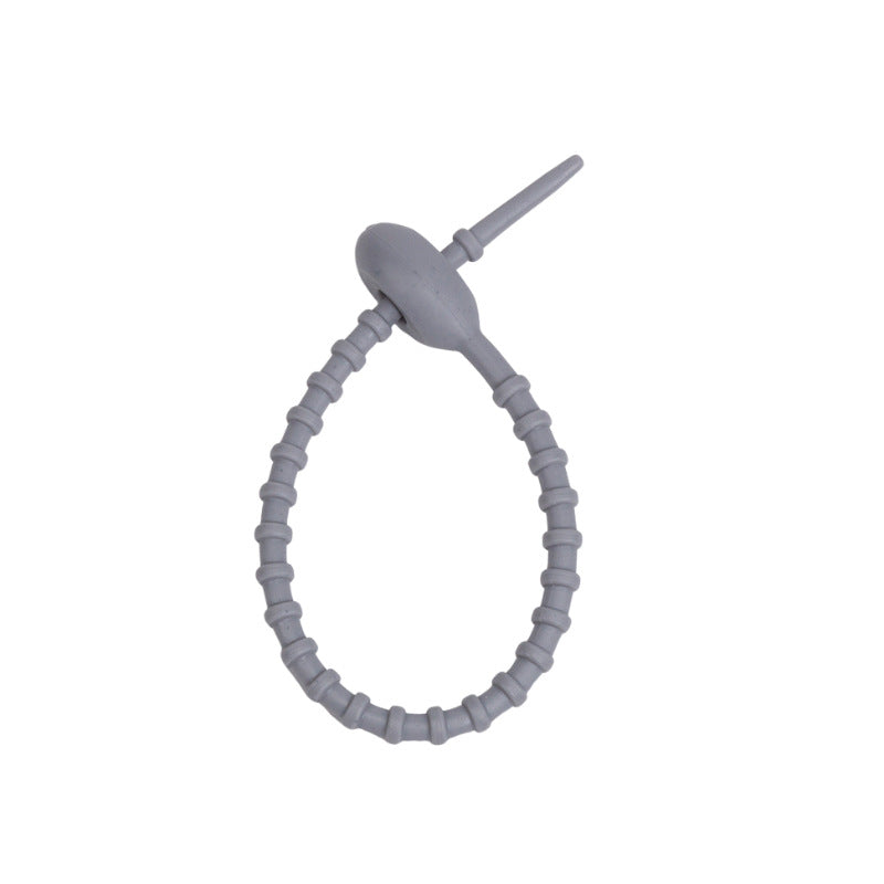 Close view of the ridged silicone strap and the tadpole head that holds the loop