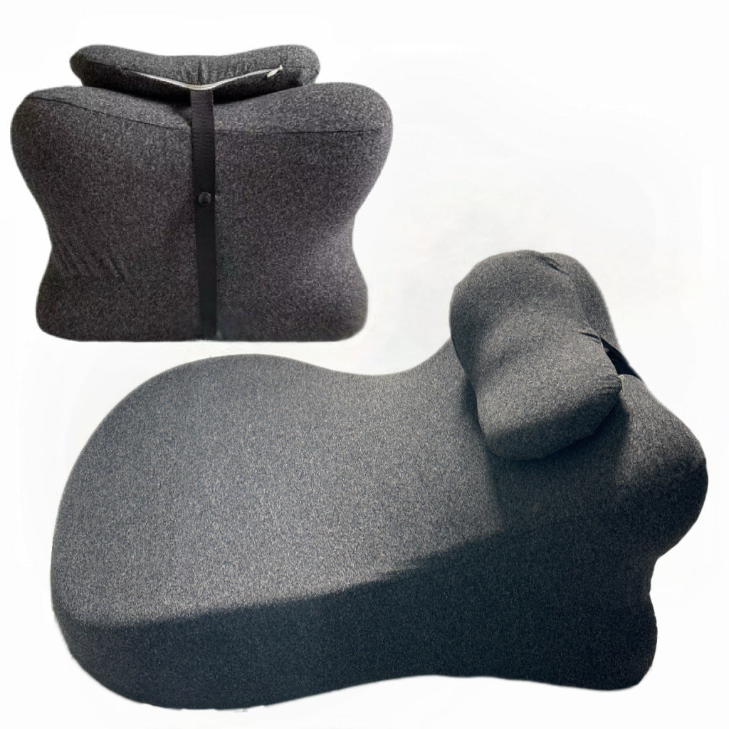 Rear and three quarter views of the deep gray back cushion showing the elastic clip strap