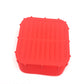 Grey silicone air fryer liner sitting inside a square air fryer basket with food