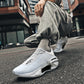 Side view of the sneaker showing the sculpted rubber sole and lace up SPORT panel