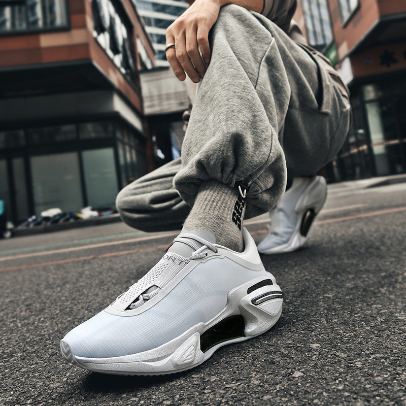 Side view of the sneaker showing the sculpted rubber sole and lace up SPORT panel