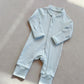 Baby Blue zip front baby romper laid flat on a gray floor, image of the 90 cm, 18 to 24 months size option
