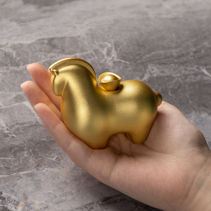 Cartoon style gold brass horse figure angled view