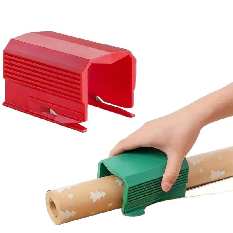 Red square tube paper cutter with a ribbed side panel next to a hand sliding a green one along a paper roll