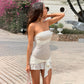 Front view of the sleeveless apricot polka dot slim fit dress