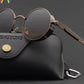 Tinted UV400 round lens sunglasses shown beside a protective case and cleaning cloth
