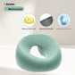 Green memory foam face rest pillow with an open center, shown with the memory foam core and detachable cover