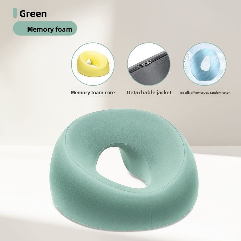 Green memory foam face rest pillow with an open center, shown with the memory foam core and detachable cover