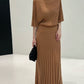 Caramel long ribbed knit skirt with flat waistband styled with a knit top, top not included