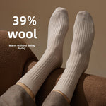 Merino wool blend mid calf socks in a solid color, folded pair on a plain background