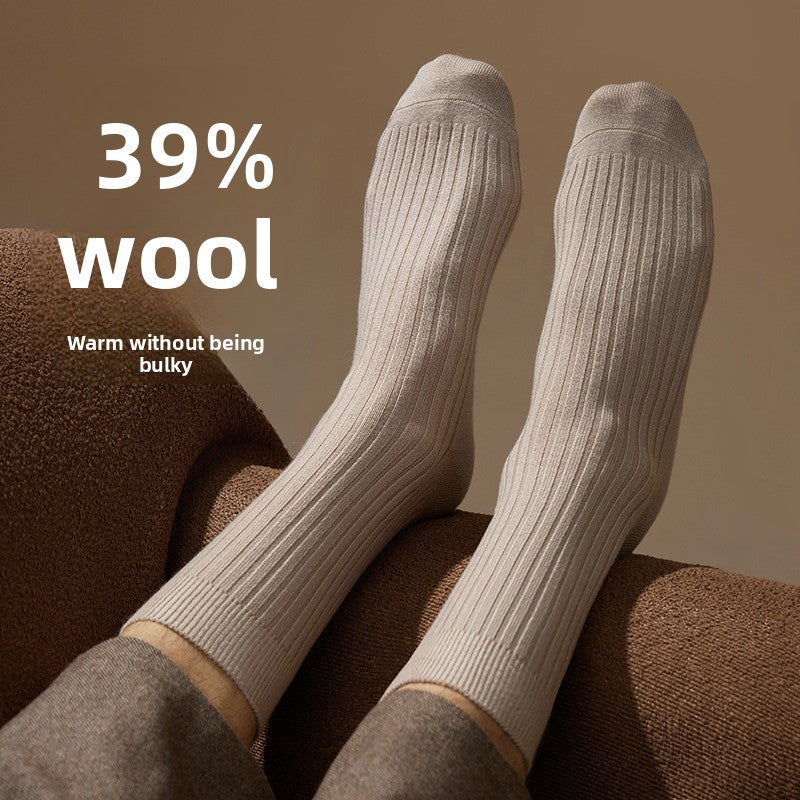 Merino wool blend mid calf socks in a solid color, folded pair on a plain background