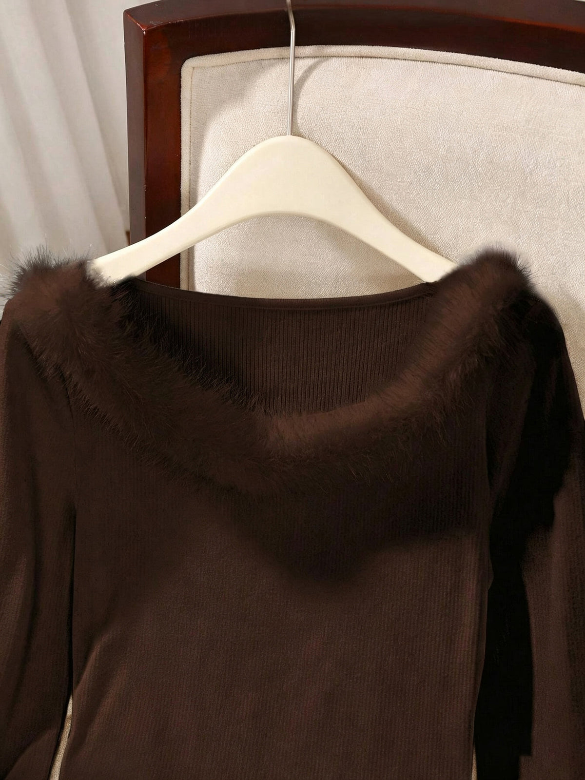 Brown ribbed top on a hanger showing the fluffy off-shoulder neckline trim up close