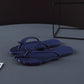 Light gray flip flops open flat showing the molded one piece EVA sole