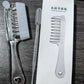 Transparent hair comb and clear dropper laid out as the complete scalp serum applicator set