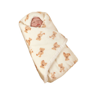 Flannel baby blanket shown from the side to reveal the folded bound edge