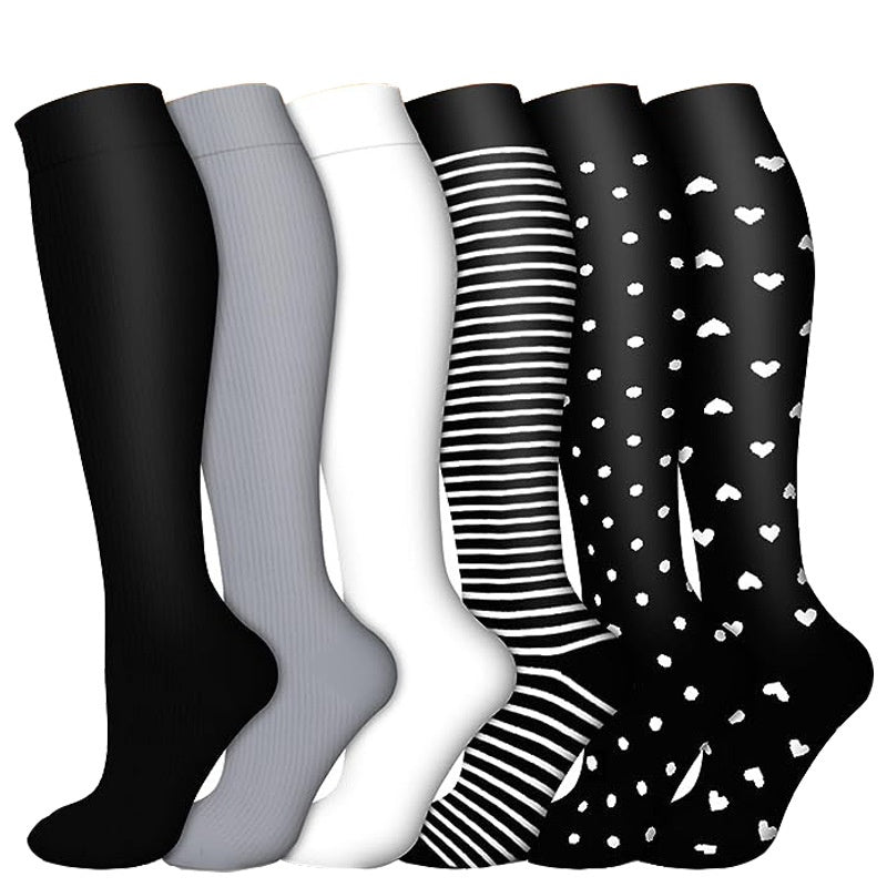 Knee high compression cycling socks with a ribbed cuff and textured sole