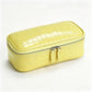 Yellow crocodile pattern genuine leather cosmetic bag with silver double zipper, three quarter view