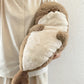 Back view of the seal plush toy showing the smooth plush surface