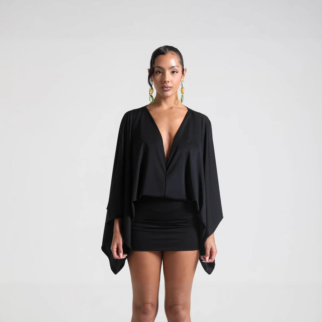 Angled view of the V-neck mini dress styled for a casual day out