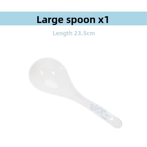 Large porcelain serving spoon with a blossom accent on the handle