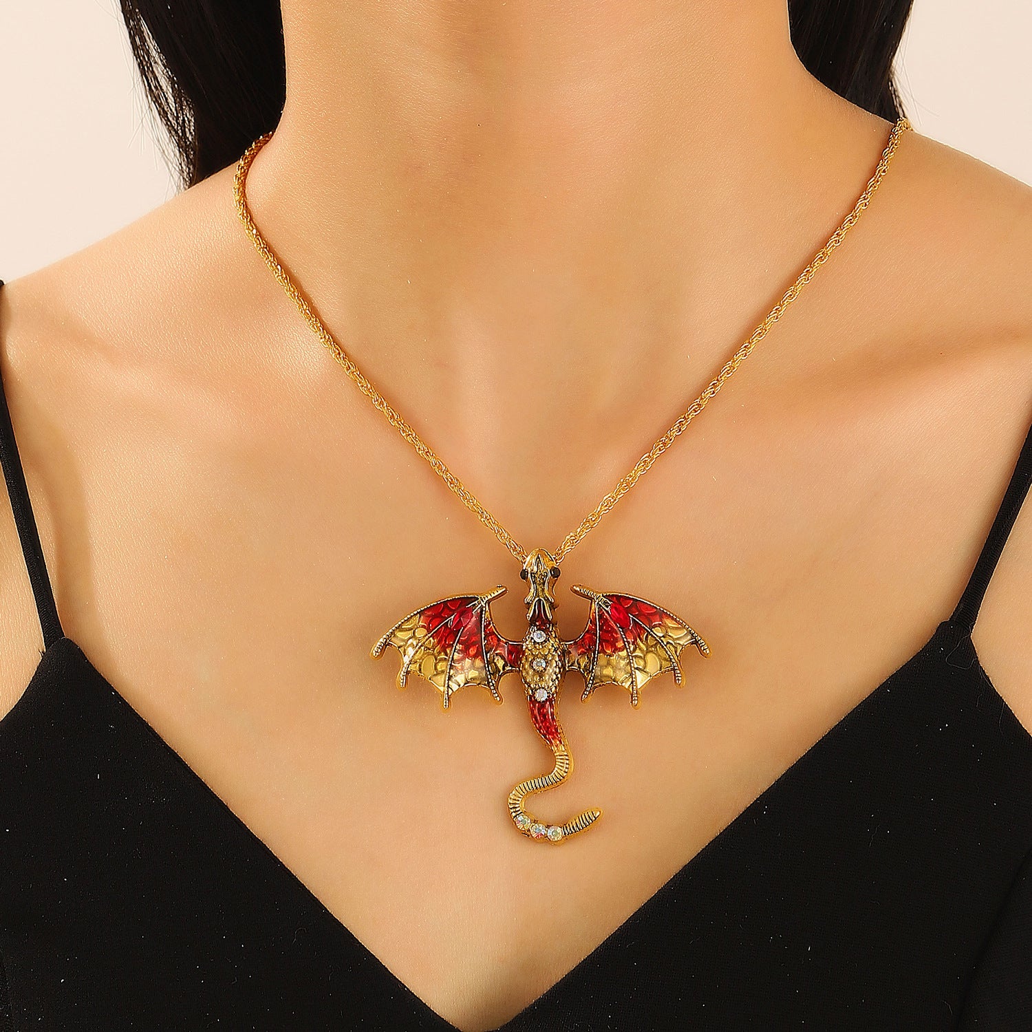 Side profile of the antiqued dragon pendant showing its raised relief depth